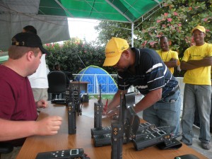 Harris Corp. personnel configure radios for use during the relief efforts.