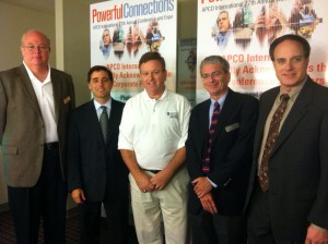 Members of the APCO International Executive Committee of the Board of Directors and staff greeted Julius Genachowski upon the conclusion of his remarks at the conference. From left: Terry Hall, Genachowski, Bill Carrow, Robert Gurss and Mark Cannon. Not pictured: Gregg Riddle, who remained on the dais.