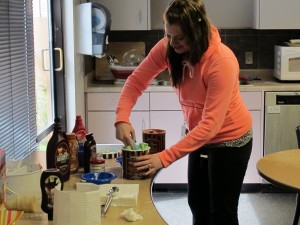 Communication Support Officer Jordan Chojnowski scoops up some mint chocolate chip ice cream on the go.