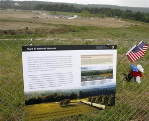 This photo shows a sign describing the plan for the entire Flight 93 memorial on the fence at the temporary memorial as construction continues at the Flight 93 Memorial in Shanksville, Pa. (AP Photo/Keith Srakocic, FILE)