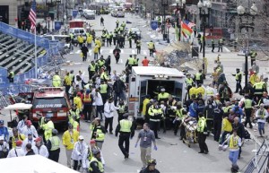  Medical workers aid injured people at the finish line of the 2013 Boston Marathon following an explosion in Boston, Monday, April 15, 2013. (AP Photo/Charles Krupa)