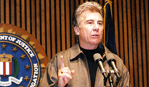 John Walsh gives his remarks during one of many Department of Justice Press Conferences. 